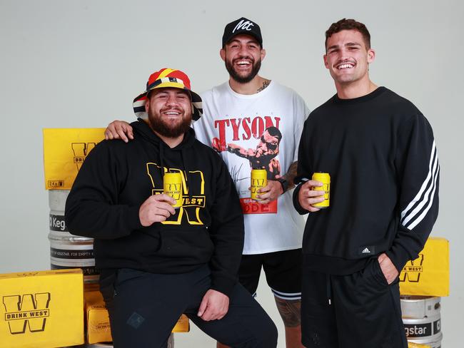 Daily Telegraph. 04, May, 2022.**Front page for Friday**Fellow Drink West owners, UFC fighters Tai Tuivasa and Tyson Pedro, with Penrith star Nathan Cleary, in Penrith, today.Picture: Justin Lloyd.