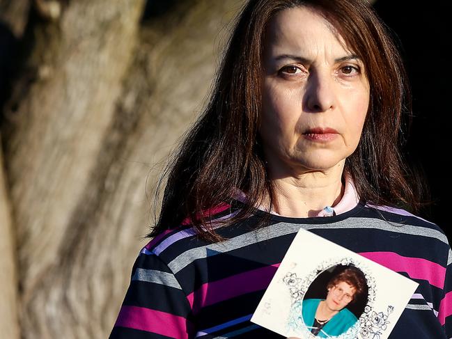 Maxine Tsihlakis holds a photograph of her mother Georgia Mitsinikos who died from coronavirus.Georgia was a resident of St Basil's Homes for the Aged in Fawkner where she contracted coronavirus. Picture : Ian Currie