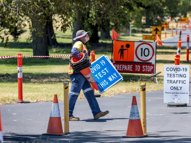 Workers pack up the Albert Park Covid testing site after it was closed due to the extreme heat on Friday. Picture: David Geraghty