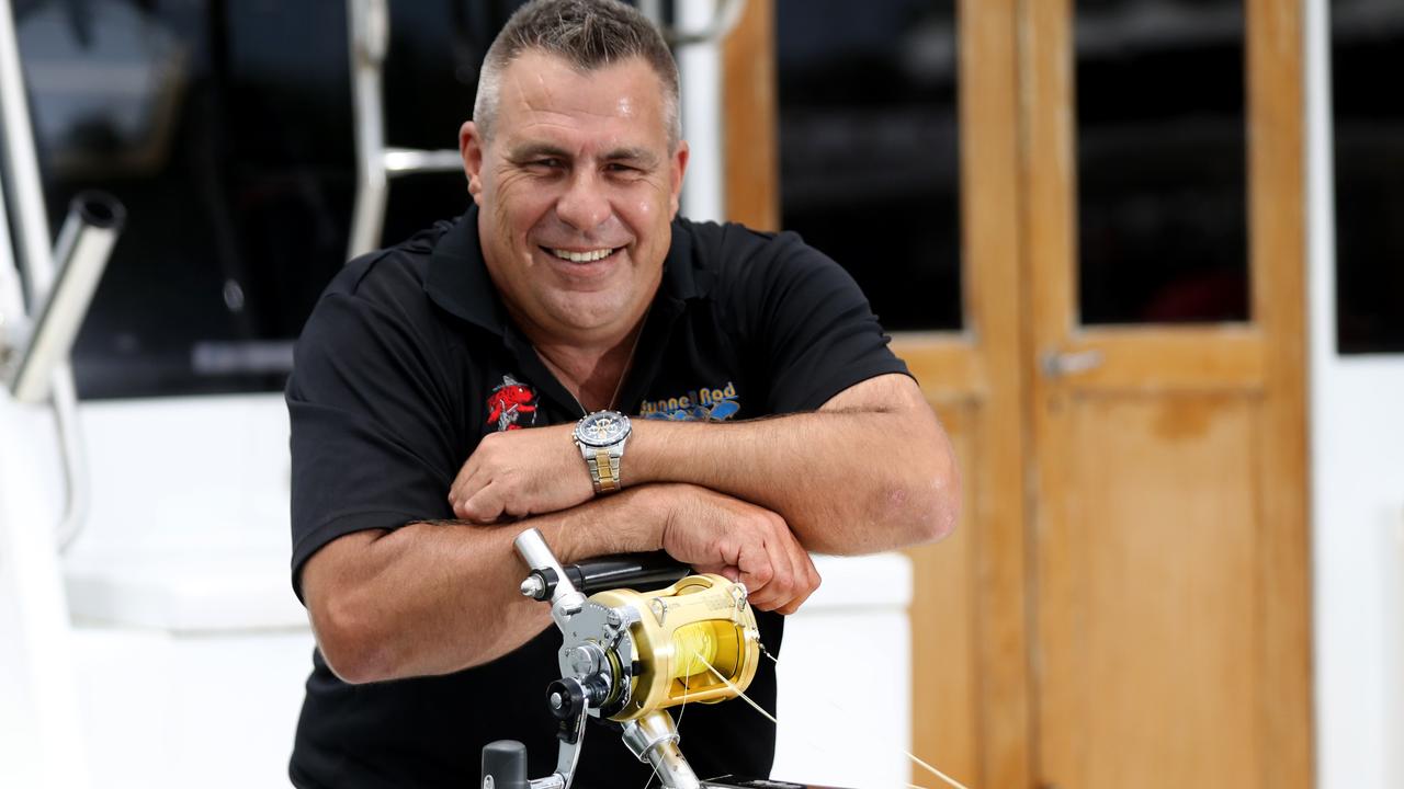 Inventor Jase Teelow with the Gunnell Rod which is a new fishing rod that mounts into the boat, and makes it easy for everyone to fish. Picture: Stewart McLean