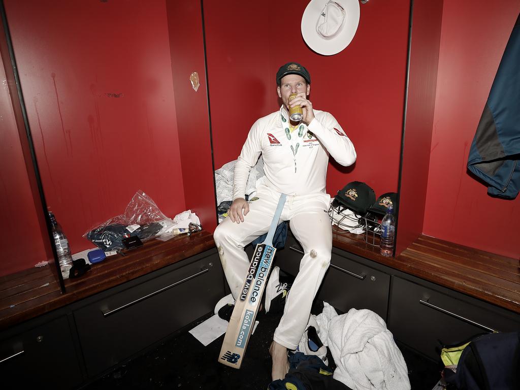 Steve Smith celebrate in the change rooms after Australia claimed victory to retain the Ashes at Old Trafford. Picture: Ryan Pierse/Getty Images