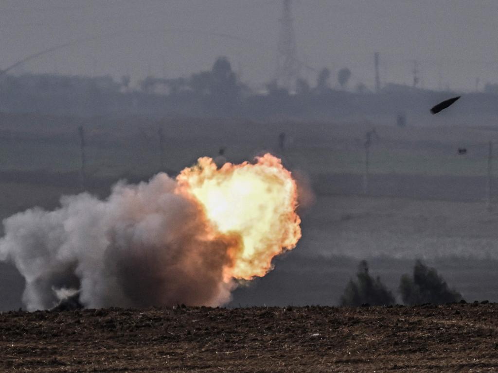 The Israeli military fires shells toward the Gaza Strip on October 28, 2023. (Photo by Arts MESSINIS / AFP)