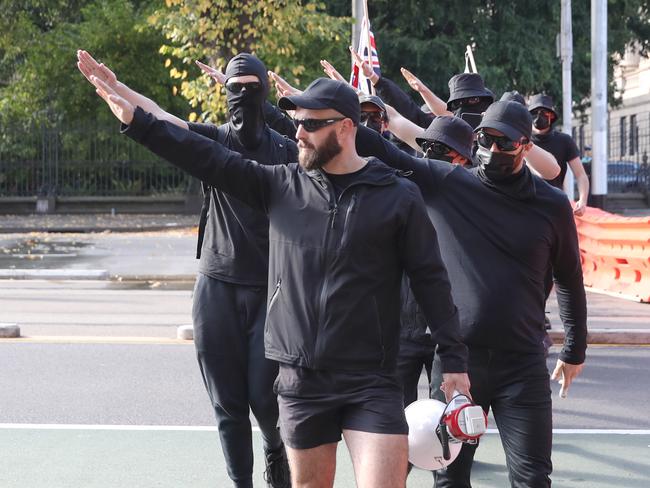 MELBOURNE, AUSTRALIA - NewsWire Photos, MAY 13, 2023.  Pro and anti immigration protesters gather in Spring st in Melbourne. Far right activist Thomas Sewell is seen giving a nazi salute. Picture: NCA NewsWire / David Crosling