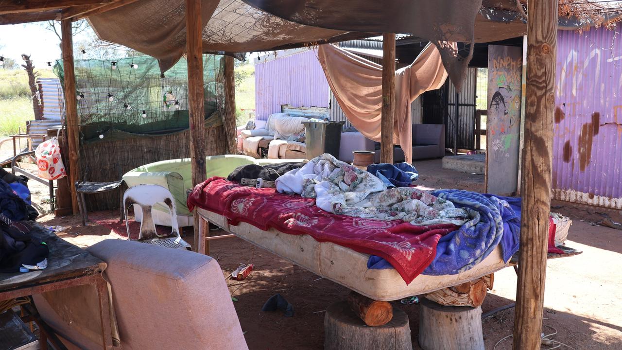 Residents at White Gate, a town camp on the outskirts of Alice Springs, sleep outside to escape the heat in the tin sheds they live in. Picture: Riley Walter