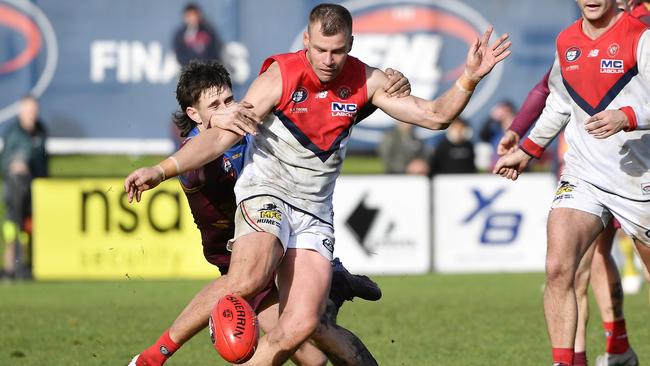 Brenton Keating gets a kick for Diamond Creek. Picture: Andrew Batsch