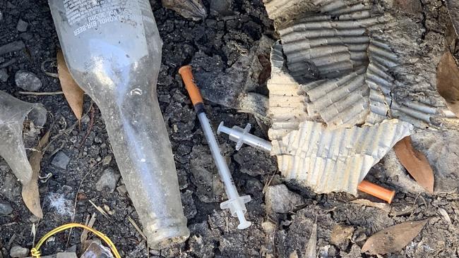 Syringes and mounds of rubbish were found in a laneway on Hemmings St. Picture: Suzan Delibasic