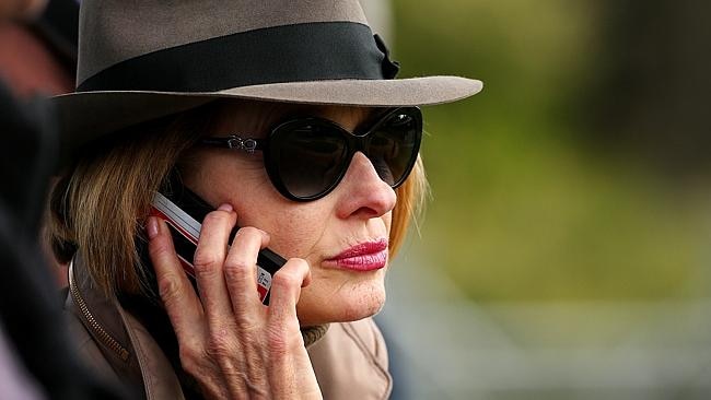 Gai Waterhouse chats on her mobile while watching international runners at Werribee. Picture: Colleen Petch