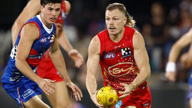 Nick Holman in action during his 100th game against the Western Bulldogs. (Photo by Michael Willson/AFL Photos via Getty Images)