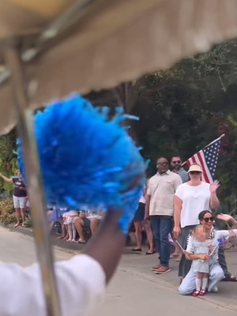 Lilibet was waving a flag alongside other revellers. Picture: rosewoodmiramarbeach/Instagram