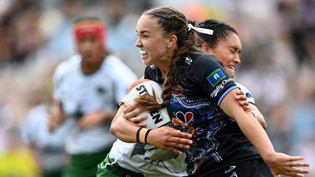 Jada Taylor of the Indigenous All Stars is tackled by Zahara Temara.