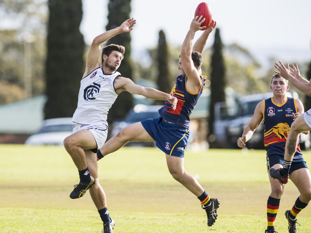 Jackson Copland (left) of Coolaroo and Ashley Harley of University in AFL Darling Downs Allieds Cup round two at USQ, Saturday, May 1, 2021. Picture: Kevin Farmer