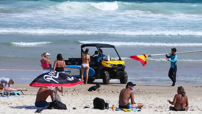 A lifeguard at North Bondi Beach with beachgoers. Picture: Gaye Gerard