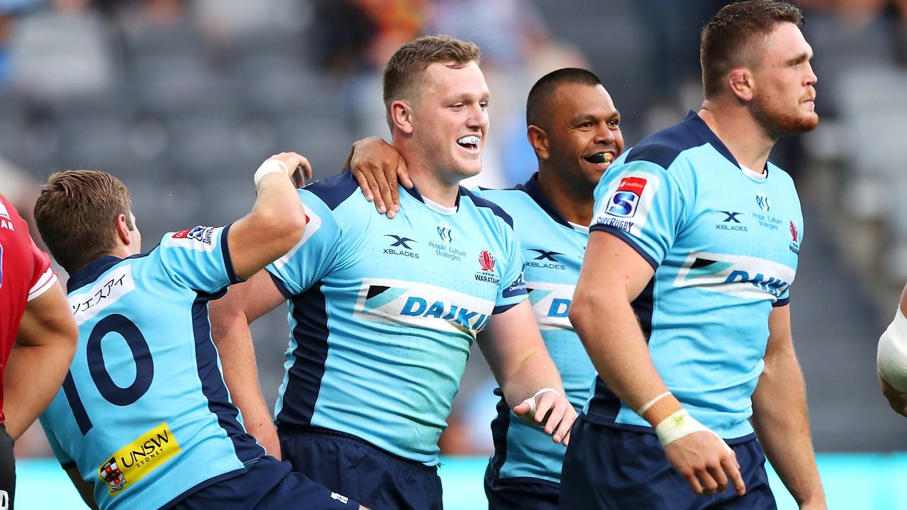 The Waratahs are overjoyed after Angus Bell scored a try against the Lions.