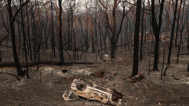 A burnt out car pictured along Ridge Rd, in Oakdale. Picture: Jonathan Ng