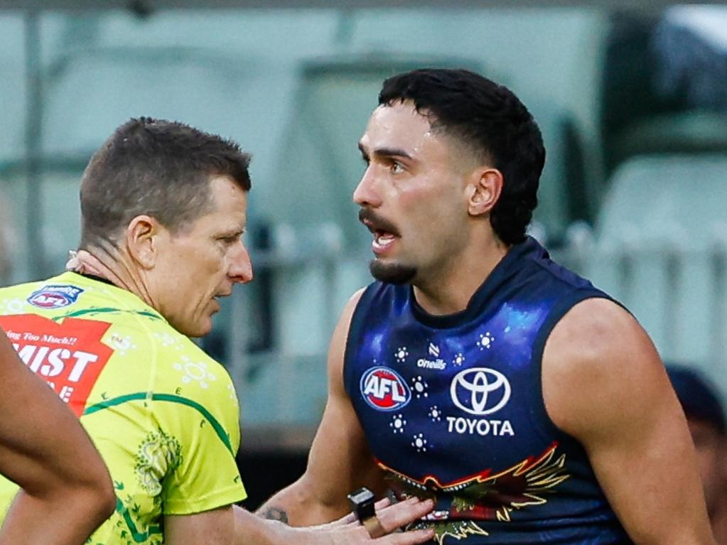 MELBOURNE, AUSTRALIA - MAY 18: Izak Rankine of the Crows disputes an umpiring decision in the dying seconds during the 2024 AFL Round 10 match between The Collingwood Magpies and Kuwarna (Adelaide Crows) at The Melbourne Cricket Ground on May 18, 2024 in Melbourne, Australia. (Photo by Dylan Burns/AFL Photos via Getty Images)