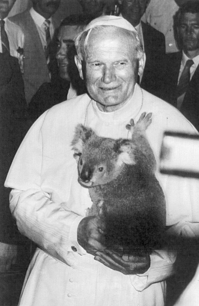 Pope John Paul II 25/11/86 – Brisbane – Pope John Paul II gets a cuddle from Lone Pine Sanctuary koala Simon at the QE II stadium in Brisbane today.