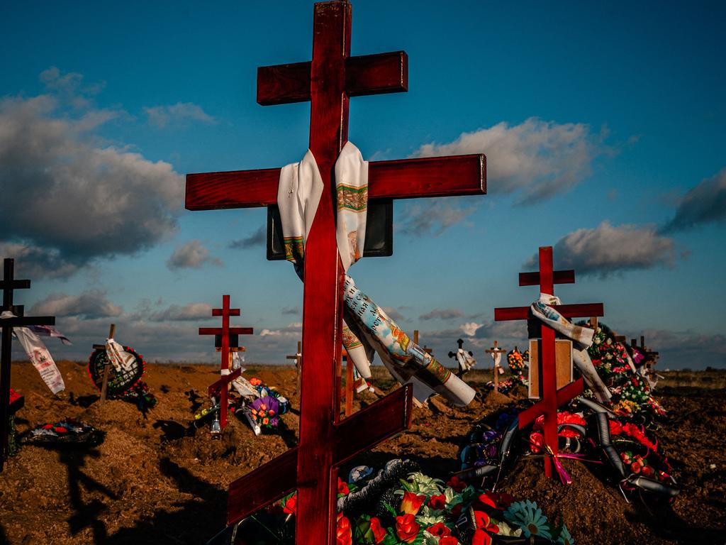 Memorial crosses are seen on the new graves at a cemetery in the southern city of Kherson. Picture: Dimitar Dilkoff/AFP