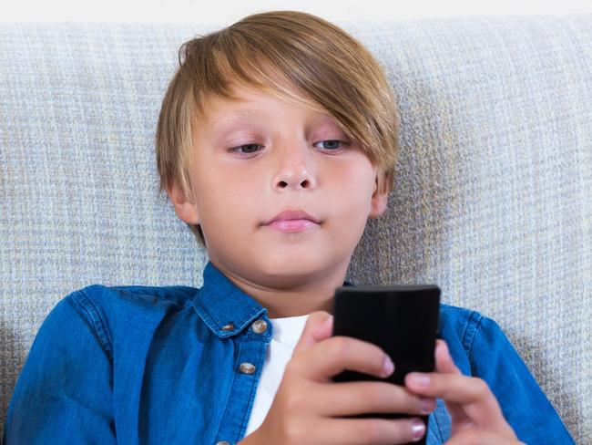 Young girl and boy on mobile phones.  Picture: iStock