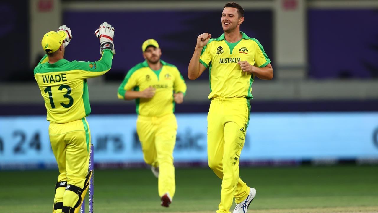 Matthew Wade and Josh Hazlewood celebrate the first wicket of the T20 World Cup Final. Picture: Getty Images