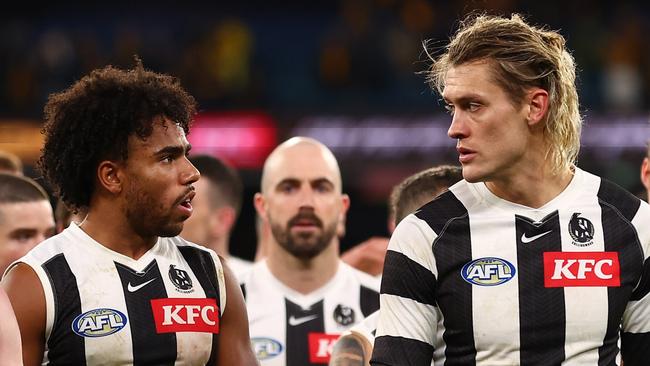 MELBOURNE, AUSTRALIA - JULY 20: The Magpies look dejected following the round 19 AFL match between Hawthorn Hawks and Collingwood Magpies at Melbourne Cricket Ground on July 20, 2024 in Melbourne, Australia. (Photo by Graham Denholm/AFL Photos/via Getty Images)