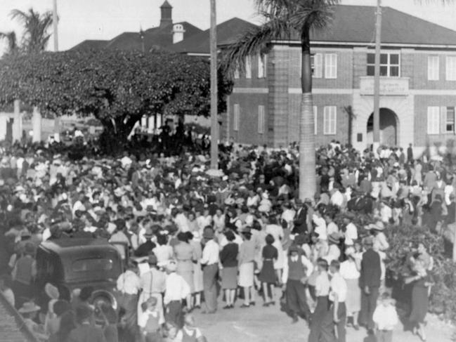 Mackay residents celebrating victory over Japan on August 13, 1945, at the intersection of Sydney St and Victoria St. The Jubilee Tree (pictured) is now at Queen's Park. Picture: Bob Camerons Collection