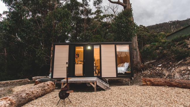 Tiny Away's newest tiny home Pirates Retreat is nestled on a hill that is surrounded by trees and overlooks the ocean at Eaglehawk Neck. Photo: Supplied by Tiny Away