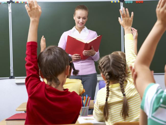 Generic image of teacher teaching students inside school classroom.