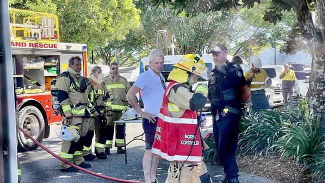 Salt House managing director Fintan Rafferty talks with emergency service crews outside the restaurant in the Cairns CBD. Photo: Peter Carruthers.