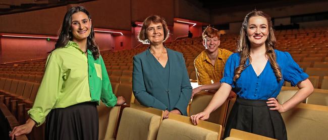 Griffith University vice-chancellor Carolyn Evans (centre) with musical theatre students (from left) Charlotte Page, Jack Ingram and Jacqui Dwyer at the Queensland Performing Arts Centre. Photo: Zak Simmonds