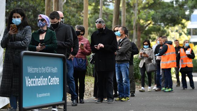 Members of the public queue outside at a mass Covid-19 vaccination hub at Sydney’s Olympic Park. Picture: NCA NewsWire