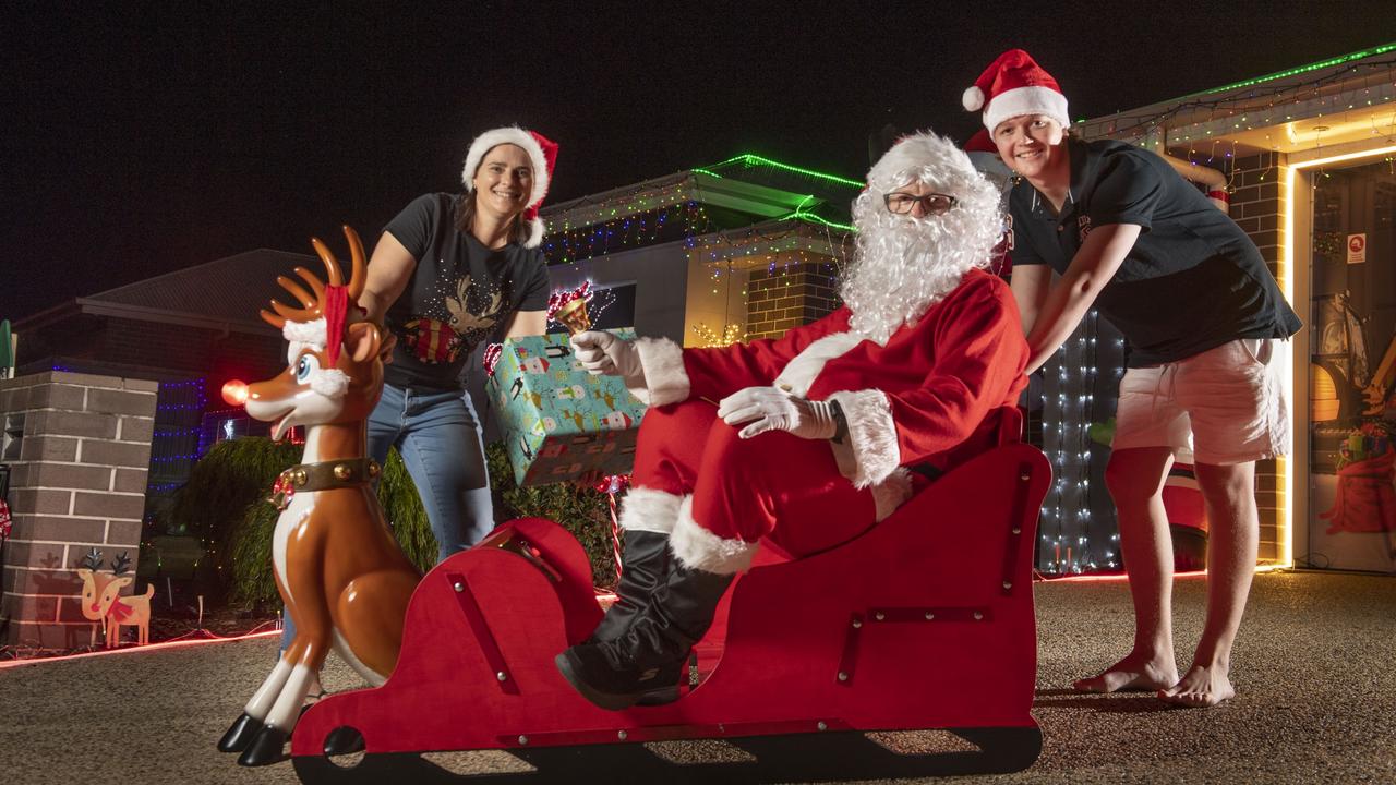 (from left) Kellie, Scott and Sam Iseppi. The Iseppi family Christmas lights display at &amp; Lockyer St Kleinton. Friday, December 10, 2021. Picture: Nev Madsen.