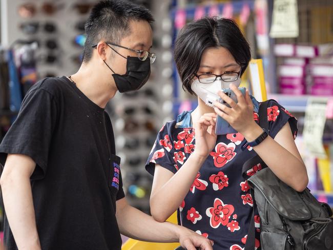 People are walking around Sydney with face masks on to protect themselves from the coronavirus. Picture: Julian Andrews