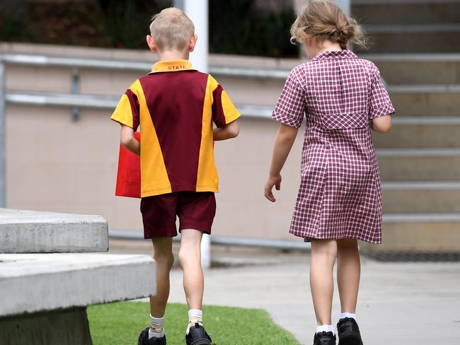 Young school students, a boy and a girl, are seen at a state primary school in Brisbane, Thursday, October 11, 2018. (AAP Image/Dan Peled) NO ARCHIVING