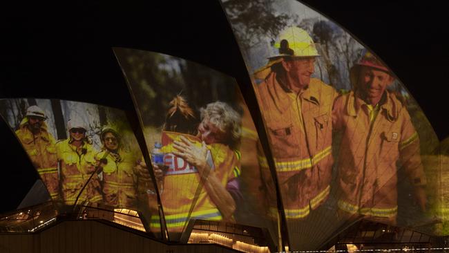 Images of firefighters are are projected on the sails of the Sydney Opera House. Picture: Getty Images