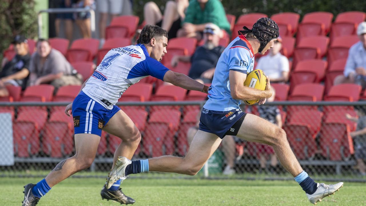 Bulldogs player Tyrone Nean attempts to stop Luke Rouland from scoring a try for the Western Clydesdales. Picture: Nev Madsen.