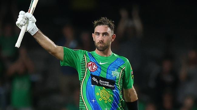 MELBOURNE, AUSTRALIA - JANUARY 13: Glenn Maxwell of the Stars raises his bat after scoring a half century during the Men's Big Bash League match between the Melbourne Renegades and the Melbourne Stars at Marvel Stadium, on January 13, 2022, in Melbourne, Australia. (Photo by Mike Owen/Getty Images)