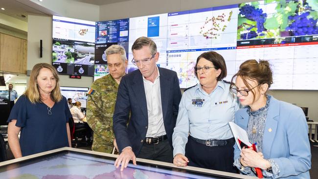 (L-R) Bureau of Meteorology's Jane Golding, Australian Defence Force Representative Brigadier Robert Lording Commander 5th Brigade, Premier Dominic Perrottet, NSW SES Commissioner Carlene York and Minister for Emergency Services and Resilience and Minister for Flood Recovery Steph Cooke pictured at the NSW RFS headquarters, Sydney Olympic Park. Picture: Monique Harmer