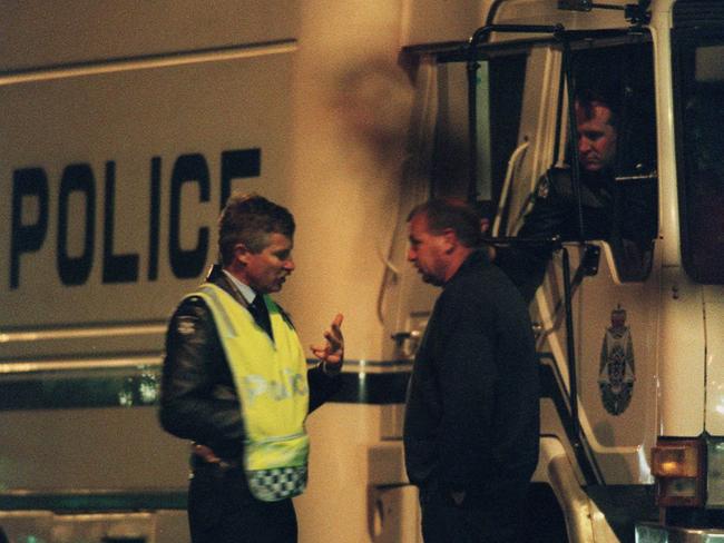 Police near the scene during the early hours following the shooting.