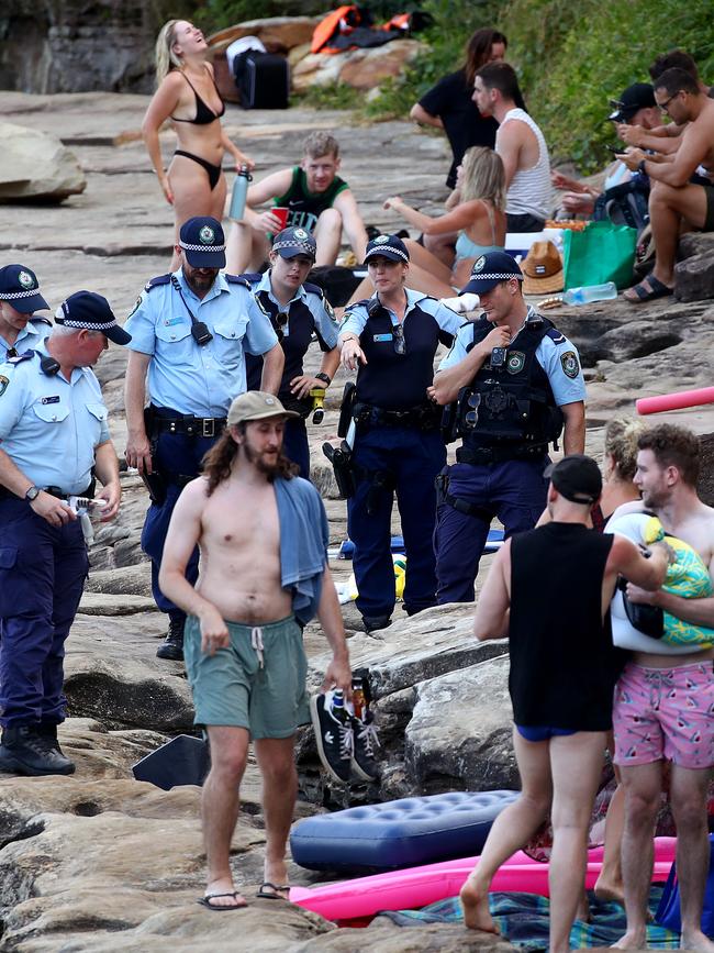 Police move on crowds at Gordon's Bay in Sydney's east after masses of people gathered for Australia Day celebrations. Picture: Toby Zerna