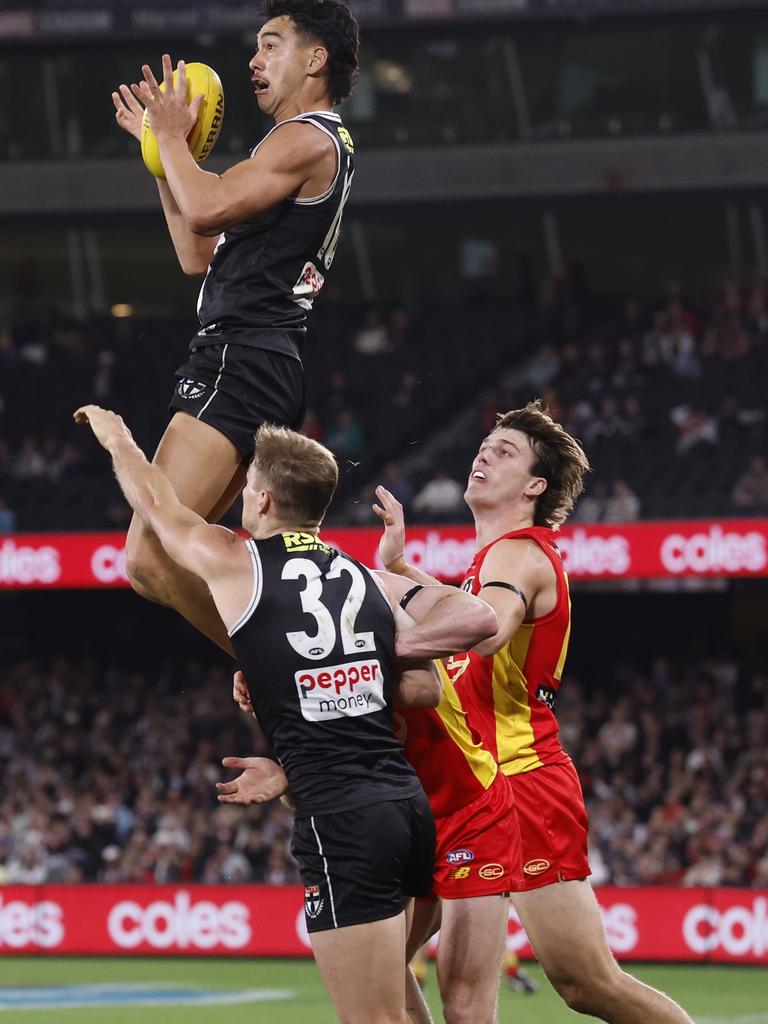 Mitch Owens sets the crowd alight with a towering mark. Picture: Darrian Traynor/Getty Images