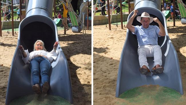 Councillor Cherie Rutherford and mayor Tony Williams going down the slide at the redeveloped playground at Rockhampton Botanic Gardens on March 11, 2023. Picture: Aden Stokes