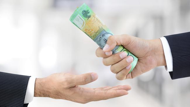 Businessman hands passing money, Australian dollar bills, tax refund generic