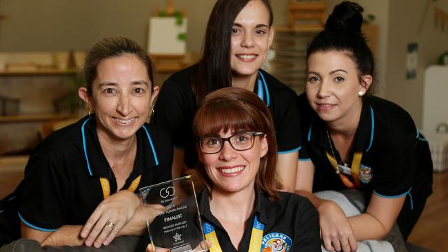 Pelicans in the City Centre with a G8 Education Core Values Award. Centre staff Brooke Maynard with the award, front, and her leadership team Carmen Stuart-Stracey, Ashleigh Turpin and Jess Miller. Picture: Stewart McLean