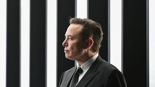 Tesla CEO Elon Musk is pictured as he attends the start of the production at Tesla's "Gigafactory" on March 22, 2022 in Gruenheide, southeast of Berlin. - US electric car pioneer Tesla received the go-ahead for its "gigafactory" in Germany on March 4, 2022, paving the way for production to begin shortly after an approval process dogged by delays and setbacks. (Photo by Patrick Pleul / POOL / AFP)