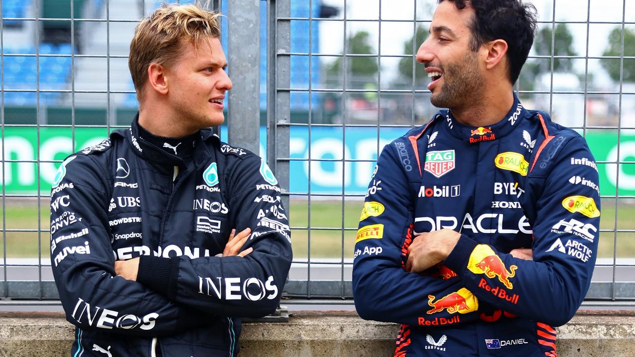 Reserve drivers Daniel Ricciardo and Mick Schumacher talk during an F1 testing event. Photo by Mark Thompson/Getty Images.