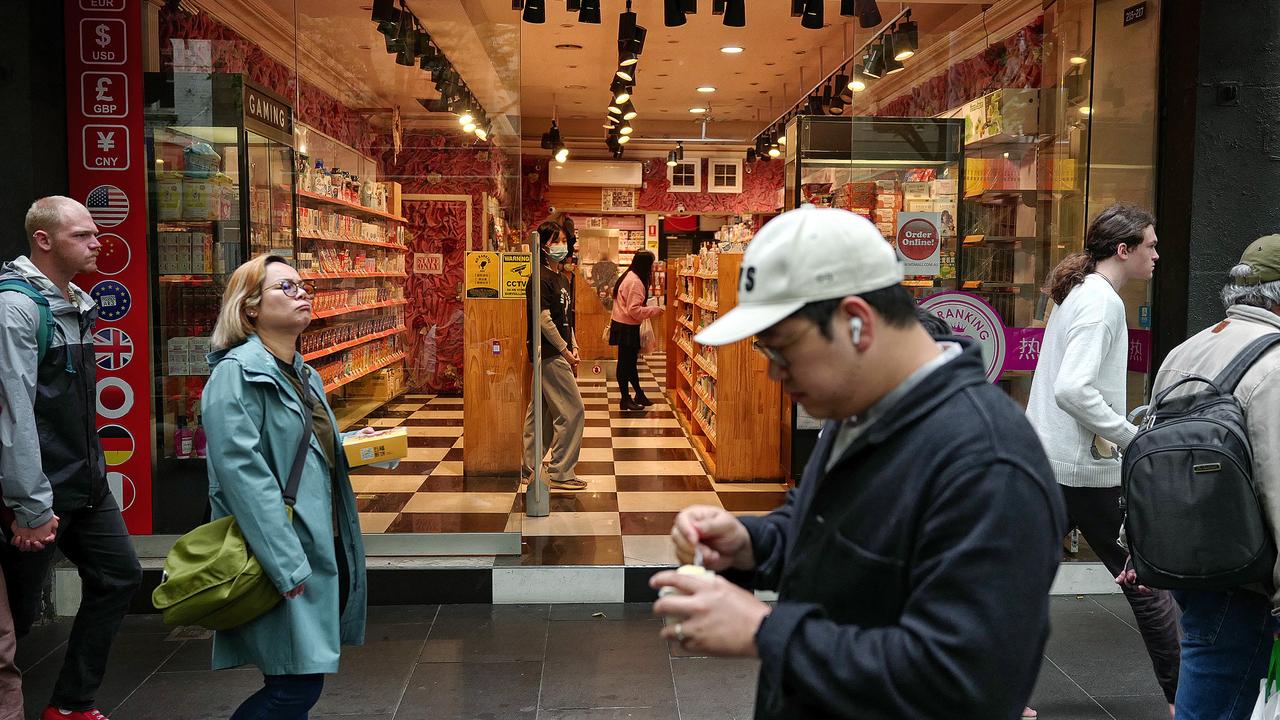 MELBOURNE, AUSTRALIA - NewsWire Photos October 23, 2022: People are pictured in Melbourne's CBD after Treasurer Jim Chalmers revealed a last minute hit to the federal budget that will cost Australians $33bn. Picture: NCA NewsWire / Luis Ascui