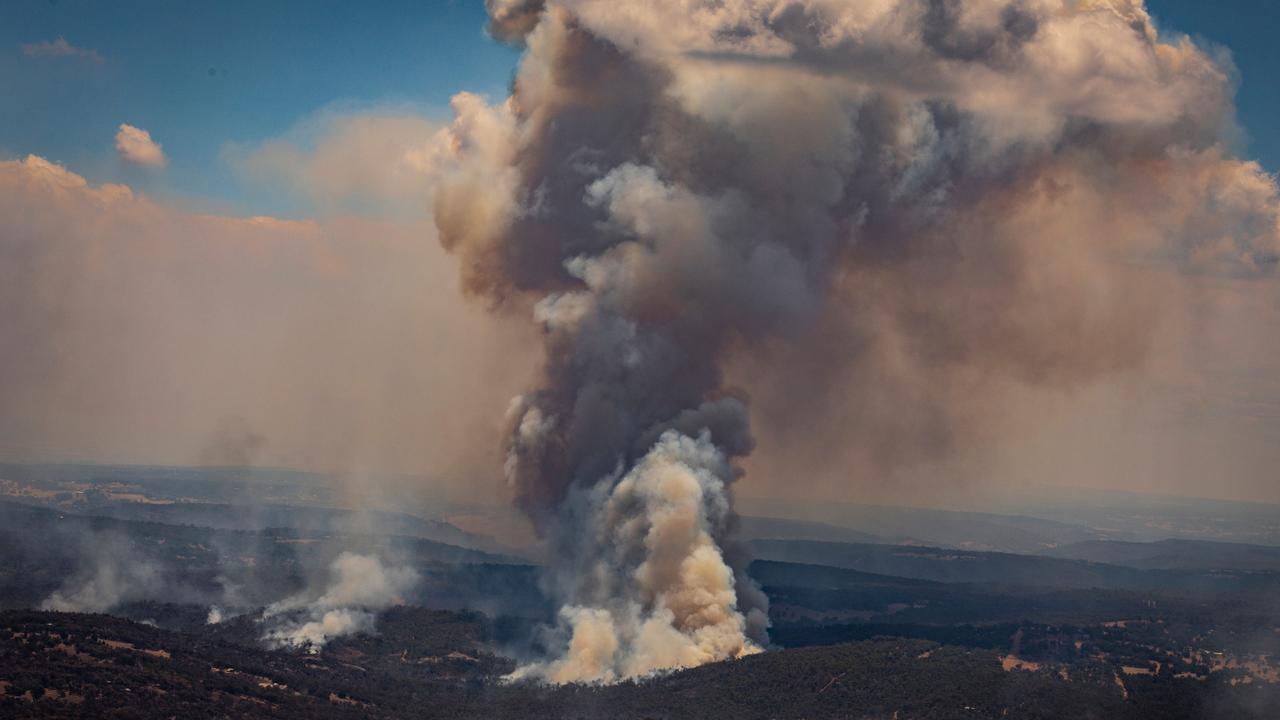 Aerial view of the bushfire that burned through more than 10,000 hectares of land and destroyed 86 homes. Picture: NCA NewsWire/Tony McDonough