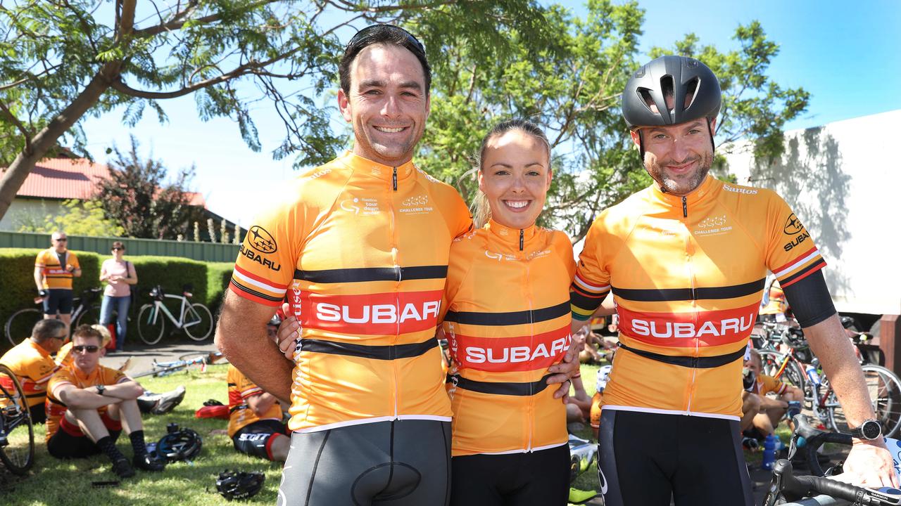 (L to R) Matt Ledgar and Ella Ledgar with James Page who was first over the line of the riders from Glenelg. (AAP Image/Dean Martin)