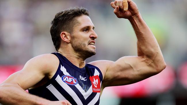 PERTH, AUSTRALIA - JUNE 15: Jesse Hogan of the Dockers celebrates after scoring a goal during the round 13 AFL match between the Fremantle Dockers and the Port Adelaide Power at Optus Stadium on June 15, 2019 in Perth, Australia. (Photo by Will Russell/AFL Photos/via Getty Images )