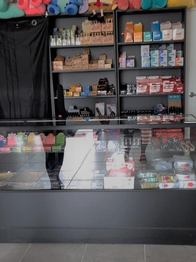 Glass cabinet and shelves on display at the Frenchville Gifts and Tobacconists.